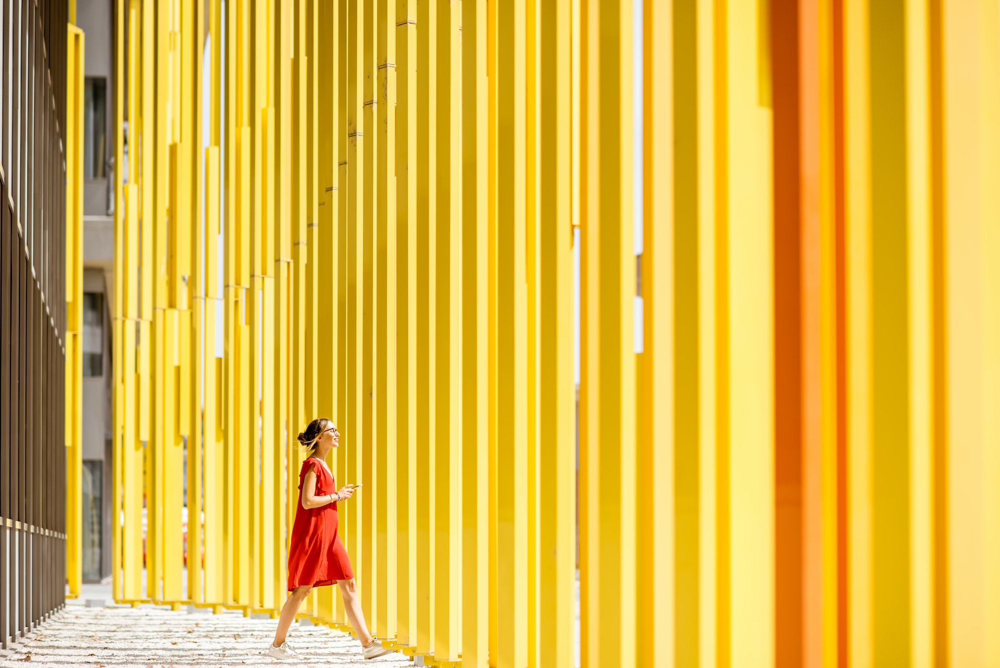 Woman on the yellow building background
